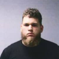 <p>Jesus Omar Rivera-Gonzalez, 26, of East Hartford, is accused of shooting firearms in a Manchester commuter parking lot.</p>