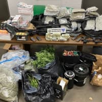<p>Springfield Police confiscated pounds of marijuana and scads of firearms after a structure fire revealed an illegal marijuana grow operation.</p>