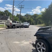 <p>The scene of a three-car crash on Sept. 20 in Ludlow. Among other things, Andrew Milne is accused of causing the crash by driving on the wrong side of the street.</p>