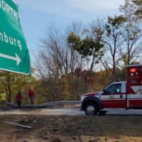<p>Emergency responders at a flat-bed rollover on I-190 Monday, Oct. 19.</p>