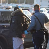 <p>Massachusetts State Police make an arrest on Sunday, Nov. 8.</p>