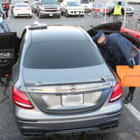 <p>Massachusetts State Police search an allegedly stolen vehicle on Sunday. Nov. 8.</p>