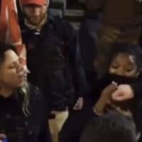 <p>This video-still is the first image on a GoFundMe for Ashanti Smith who is accused of punching a woman at the Jan. 6 Capitol Building riot. Smith said she was acting in self-defense.</p>