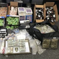 <p>Items allegedly seized by law enforcement at an Elam Road residence in Fitchburg</p>
