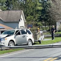 <p>The PPL pole laying across the roadway.</p>