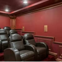 <p>A custom seven seat movie theatre.</p>