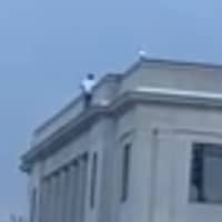 <p>A man was climbed to the top of Linden&#x27;s city hall Monday and threatened to jump</p>