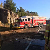 <p>Crews from a local fire department arrive at the scene of a one-car crash on Route 8 in Shelton Friday morning.</p>