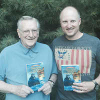 <p>Robert A. Skead and Robert J. Skead, from left, pose with &quot;Submarines, Secrets and a Dark Rescue,&quot; the sequel to their first novel, &quot;Patriots, Redcoats and Spies.&quot;</p>