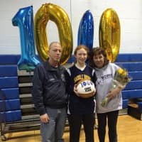 <p>Saddle Brook&#x27;s Cherie Smedile celebrates her 1,000th career point with her parents.</p>