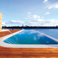 <p>SoJo Spa&#x27;s infinity pool overlooks the Hudson river and New York City skyline.</p>