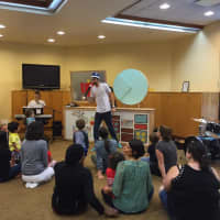 <p>Songs for Seeds -- pictured performing for children and parents -- will hold a free concert at the Ardsley Public Library.</p>