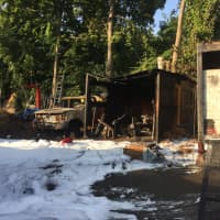 <p>Several trucks caught fire at a landscaping company on South Street in Danbury on Tuesday night.</p>