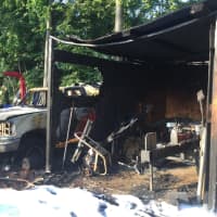 <p>Several trucks caught fire at a landscaping company on South Street in Danbury on Tuesday night.</p>
