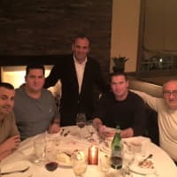 <p>Sal Derguti, co-owner of Sparkill Steakhouse, schmoozes with customers.</p>