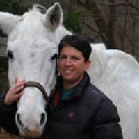 <p>Dana Spett, founder and executive director of Pony Power, with one of the horses at Three Sisters Farm in Mahwah, N.J.</p>