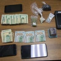 <p>Money and drugs seized during stop.</p>