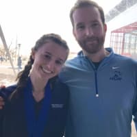 <p>Tess Stapleton, left, with Heads Up Running coach Justin Tomczyk, won two medals at nationals, in the long jump and high jump.</p>