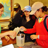 <p>Larissa Chraim and Dorothy Cucci work on an activity at Lamont-Doherty, part of the SUEZ Leadership Institute.</p>