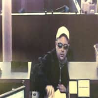 <p>Surveillance footage of the suspect in a bank robbery that took place at the Chase Bank on Main Street in Westport on June 1.</p>