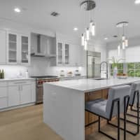 <p>Kitchens include shaker style custom wood cabinetry and premium stainless steel appliances.</p>