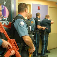 <p>Police scope out the premises during Thursday&#x27;s active shooter drill at The Valley Hospital.</p>