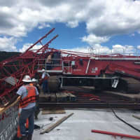 <p>The boom of a crane working on the new bridge collapsed across the existing Tappan Zee Bridge on Tuesday.</p>