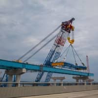 <p>The &quot;I Lift NY&quot; super crane places a steel girder assembly on the new Tappan Zee Bridge.</p>