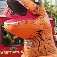 <p>A dinosaur makes an appearance at the Tarrytown Halloween Parade.</p>