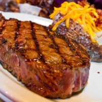 <p>Texas Roadhouse&#x27;s Western-themed menu features hand-cut steaks and loaded baked potatoes.</p>