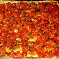 <p>The &quot;Grandma Pizza&quot; is a Sicilian-style pizza with fresh tomatoes, basil, extra virgin olive oil and garlic.</p>
