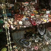 <p>The shop has shelves of costume, vintage and antique jewelry and personal items.</p>