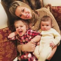 <p>Christina Kozlowski snuggles with her two girls. The North Salem occupation therapist has launched a subscription box business for clients with children on the autism spectrum.</p>