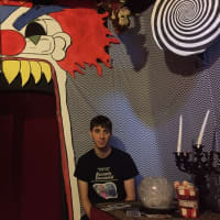 <p>Chris Arturi sits in the Funhouse Room, part of his haunted house in Stony Point, Thirty Knapp Road.</p>