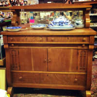 <p>This &quot;gorgeous tiger oak sideboard/server circa 1900&quot; has been one of the antique occupants of Fleming&#x27;s shop.</p>