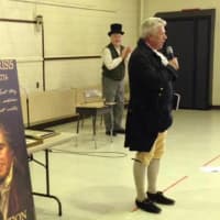 <p>Thomas Paine re-enactor Ken Miller talks to students at Fort Lee School 2.</p>