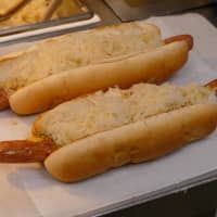 <p>Tomlinson&#x27;s &quot;long dogs&quot; can scarcely be contained by their buns.</p>