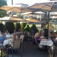 <p>White tablecloths and umbrellas enhance the outdoor dining experience at Toscana Ristorante in Tuckahoe.</p>