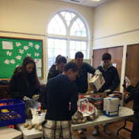 <p>Student volunteers helped out after delivering the donated food to the Daily Bread food pantry in Danbury</p>