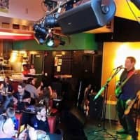 <p>Musicians perform at Two Boots recently. The Bridgeport food and music venue closed this week due to financial struggles.</p>