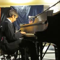 <p>Max Fernandez (piano/vocal), Sean Russo (drums) behind the piano.</p>