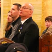 <p>Stephen Petruzzello&#x27;s father, Ron, and loved ones at Mass in Fairview.</p>