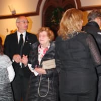 <p>Attendees including his father, Ron (left), honored Cliffside Park Police Officer Stephen Petruzzello.</p>
