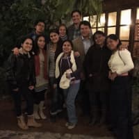 <p>Josh and Andra Carter pose with employees of their cafe in Ecuador.</p>