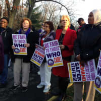 <p>State Assemblywoman Shelley Mayer stands with employees of the Sprain Brook Manor Rehabilitation Center in Scarsdale during a recent candlelight vigil.</p>