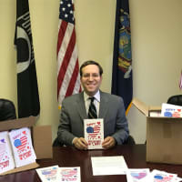 <p>Assemblyman David Buchwald with Valentine’s Day Cards before they were sent to active U.S. military troops serving in Iraq.</p>