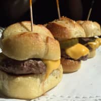 <p>Can&#x27;t manage to snarf down one of Valhalla Crossing&#x27;s enormous burgers? Try the cheeseburger sliders instead. Same beef, just in a smaller package.</p>
