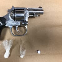 <p>The gun and drugs seized.</p>