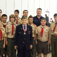 <p>Mount Pleasant veteran takes a photo with the Boy Scouts from Troop 1 during the 2015 Veterans Pancake Breakfast held earlier this month.</p>