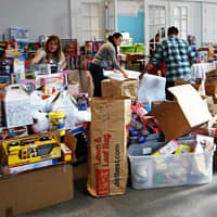 <p>Volunteers prepare the Holiday Toy Store in 2015.</p>